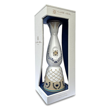 700ml white ceramic bottle of Clase Azul Anejo tequila inside the display case.