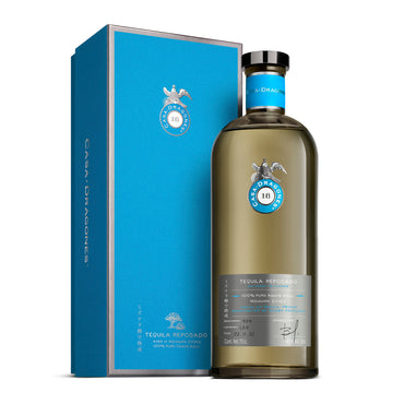 Casa Dragones Reposado tequila bottle and box on a white background
