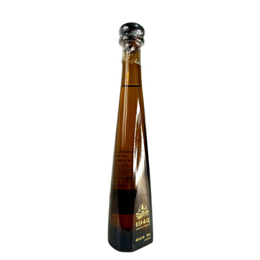 Don Julio 1942 tequila 50ml miniature bottle angled view on white background