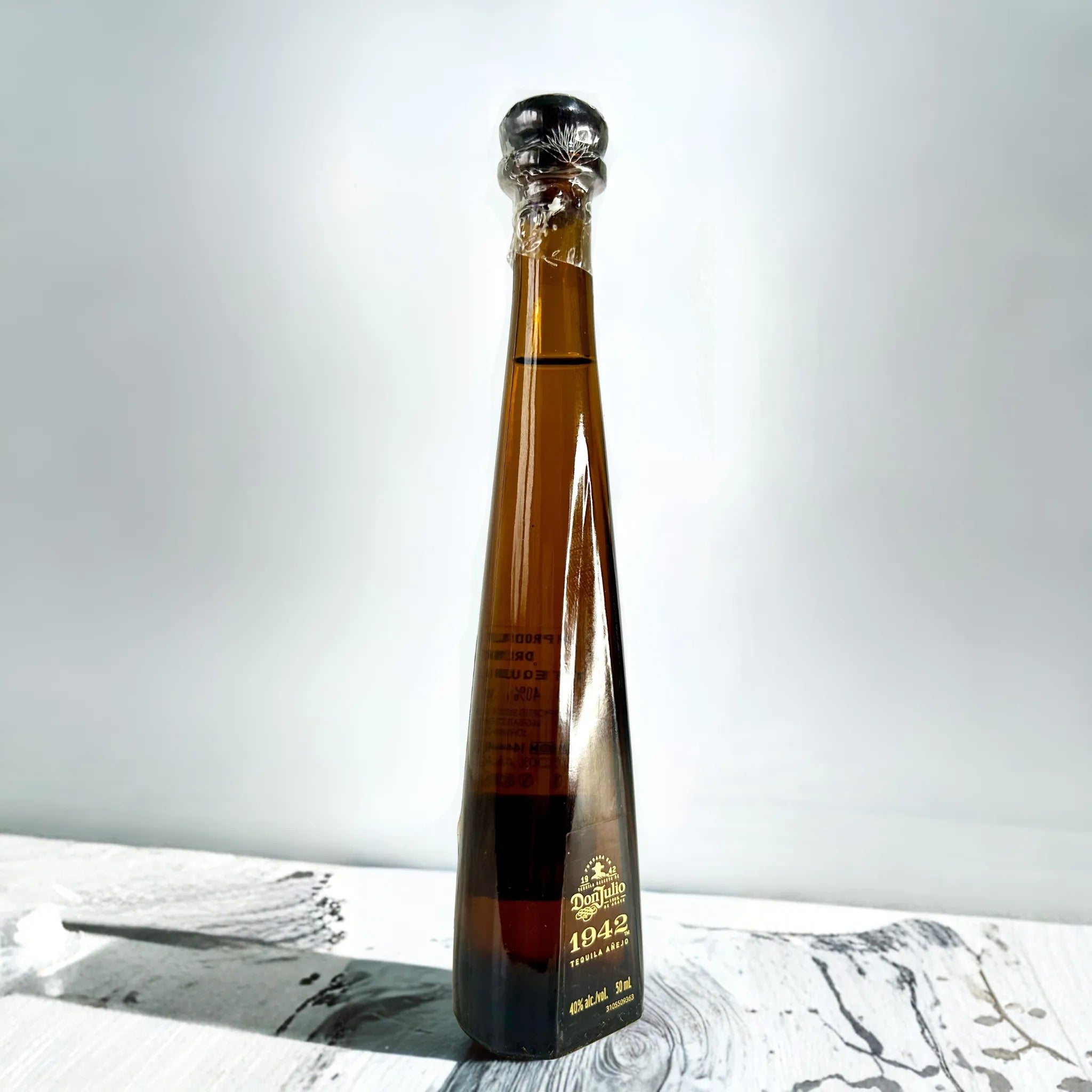 Don Julio 1942 tequila 50ml miniature bottle angled view